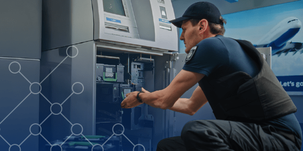 worker fixing atm